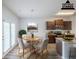 Virtually staged kitchen features stainless appliances, granite countertops, and wood cabinets at 1003 Eldon Ln, Fairburn, GA 30213
