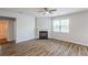 Spacious living room with hardwood floors and a fireplace at 1003 Eldon Ln, Fairburn, GA 30213
