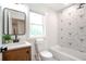 Bathroom features a modern vanity, a tiled shower and a window at 2294 Hill Nw St, Atlanta, GA 30318