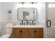 Bathroom with double sink vanity, modern fixtures, and framed mirrors at 2294 Hill Nw St, Atlanta, GA 30318