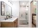 Modern bathroom featuring a double sink vanity and glass enclosed shower at 2294 Hill Nw St, Atlanta, GA 30318