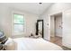 Bedroom featuring a window, light wood floors, and a neutral color scheme at 2294 Hill Nw St, Atlanta, GA 30318