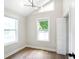 Bedroom with hardwood floors, neutral walls, modern lighting fixture, and two windows at 2294 Hill Nw St, Atlanta, GA 30318