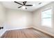 Bedroom with hardwood floors, neutral walls, modern ceiling fan, and window at 2294 Hill Nw St, Atlanta, GA 30318