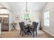 Stylish dining area featuring a modern light fixture and large windows at 2294 Hill Nw St, Atlanta, GA 30318