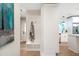 Entryway with a bench and coat hooks leading to a kitchen with modern appliances at 2294 Hill Nw St, Atlanta, GA 30318