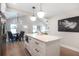 Kitchen island with marble countertop and black fixtures with dining area and living room views at 2294 Hill Nw St, Atlanta, GA 30318