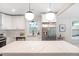 Bright kitchen features stainless steel appliances, white cabinets, and a large island with countertop at 2294 Hill Nw St, Atlanta, GA 30318