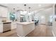 A kitchen with white cabinets, an island with a marble countertop, and stainless steel appliances at 2294 Hill Nw St, Atlanta, GA 30318