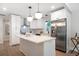 Modern kitchen featuring white cabinetry, stainless steel appliances, and a center island at 2294 Hill Nw St, Atlanta, GA 30318