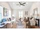 Comfortable living area with modern furniture, a ceiling fan, and bright natural lighting at 2294 Hill Nw St, Atlanta, GA 30318