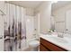 Bathroom featuring a shower with curtain, toilet, and single sink vanity at 280 Lakestone Pkwy, Woodstock, GA 30188
