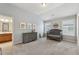 Carpeted bedroom featuring a crib, dresser, and an ensuite bathroom at 280 Lakestone Pkwy, Woodstock, GA 30188