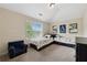 Carpeted bedroom featuring two twin beds, storage drawers, and an armchair at 280 Lakestone Pkwy, Woodstock, GA 30188