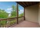 A spacious deck with wood flooring and railings offers scenic views of the surrounding lush landscape at 280 Lakestone Pkwy, Woodstock, GA 30188
