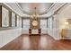 Dining room featuring hardwood floors, wainscoting, decorative lighting, and ample natural light at 280 Lakestone Pkwy, Woodstock, GA 30188