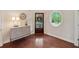 Stylish entryway with hardwood floors, a decorative console table, and a round window at 280 Lakestone Pkwy, Woodstock, GA 30188