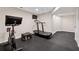 Home gym with exercise bike, treadmill, and box at 280 Lakestone Pkwy, Woodstock, GA 30188