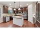 Bright kitchen featuring granite countertops, stainless appliances, and a functional center island at 280 Lakestone Pkwy, Woodstock, GA 30188