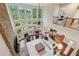 Grand living room with soaring ceilings, stone fireplace, and walls of large windows at 280 Lakestone Pkwy, Woodstock, GA 30188