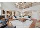 Open-concept living room boasts stone fireplace, second story overlook, and open flow to the kitchen at 280 Lakestone Pkwy, Woodstock, GA 30188