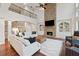 Spacious living room featuring a stone fireplace and soaring ceilings for an open and airy feel at 280 Lakestone Pkwy, Woodstock, GA 30188