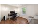 Office with hardwood floors, natural light, modern desk, and comfortable seating at 280 Lakestone Pkwy, Woodstock, GA 30188