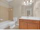 Bathroom with oak vanity, tub, shower with tiled wall, tile floor, and large mirror at 308 Holbrook Rd # Bldg 11, Smyrna, GA 30082