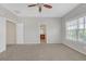 Bedroom with carpet flooring, natural light, and open doorway to an on-suite bathroom at 308 Holbrook Rd # Bldg 11, Smyrna, GA 30082