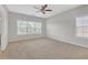Sunlit bedroom with windows, ceiling fan, carpet floors and neutral paint at 308 Holbrook Rd # Bldg 11, Smyrna, GA 30082