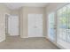 Bedroom with carpet flooring, natural light, and walk out door to a patio at 308 Holbrook Rd # Bldg 11, Smyrna, GA 30082