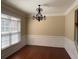 Elegant dining room with dark hardwood floors, modern lighting and classic wainscoting detail at 308 Holbrook Rd # Bldg 11, Smyrna, GA 30082