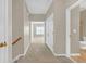 Upstairs hallway with carpet floors, white walls, and an open doorway to the bedroom and bathroom at 308 Holbrook Rd # Bldg 11, Smyrna, GA 30082