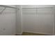 Spacious walk-in closet with wire shelving on white walls and beige carpeted floors at 308 Holbrook Rd # Bldg 11, Smyrna, GA 30082