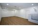 Spacious basement with wood floors, ample lighting, and a utility area at 4328 Alison Jane Ne Dr, Kennesaw, GA 30144
