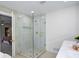 Modern bathroom featuring a glass shower with gold fixtures and neutral tile work at 4328 Alison Jane Ne Dr, Kennesaw, GA 30144