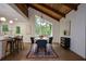 Stylish dining area featuring a large window, modern lighting, and an open layout at 4328 Alison Jane Ne Dr, Kennesaw, GA 30144