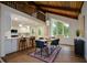 Stylish dining area featuring a large window, modern lighting, and an open layout at 4328 Alison Jane Ne Dr, Kennesaw, GA 30144