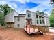 Contemporary home with a unique exterior, inviting deck, and beautiful natural surroundings at 4328 Alison Jane Ne Dr, Kennesaw, GA 30144