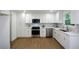 Bright kitchen with white cabinets, stainless steel appliances, and stylish countertops at 4328 Alison Jane Ne Dr, Kennesaw, GA 30144