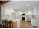 Modern kitchen with white cabinets, a center island, and stainless steel appliances at 4328 Alison Jane Ne Dr, Kennesaw, GA 30144