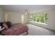 Spacious main bedroom with a large bay window and neutral decor at 4328 Alison Jane Ne Dr, Kennesaw, GA 30144