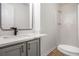Modern bathroom featuring a vanity, mirror, toilet, and walk-in shower at 450 High Creek Trce, Roswell, GA 30076