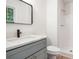 Bathroom with a shower, sink, toilet, and mirror at 450 High Creek Trce, Roswell, GA 30076