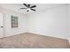 Minimalist bedroom with neutral carpet, window, and ample natural light at 450 High Creek Trce, Roswell, GA 30076
