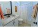 Well-lit bathroom featuring granite countertops and a shower with a themed shower curtain at 516 Barnwood Dr, Rockmart, GA 30153