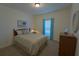 Bright bedroom with a queen size bed and natural light from the window at 516 Barnwood Dr, Rockmart, GA 30153