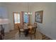 Cozy dining area featuring a wooden table, seating for four, with a view of the backyard at 516 Barnwood Dr, Rockmart, GA 30153