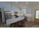 Well-appointed kitchen with stainless steel appliances, sleek white cabinetry, and granite countertops at 516 Barnwood Dr, Rockmart, GA 30153