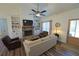 Comfortable living room featuring a stone fireplace, built-in shelving, and natural light at 516 Barnwood Dr, Rockmart, GA 30153